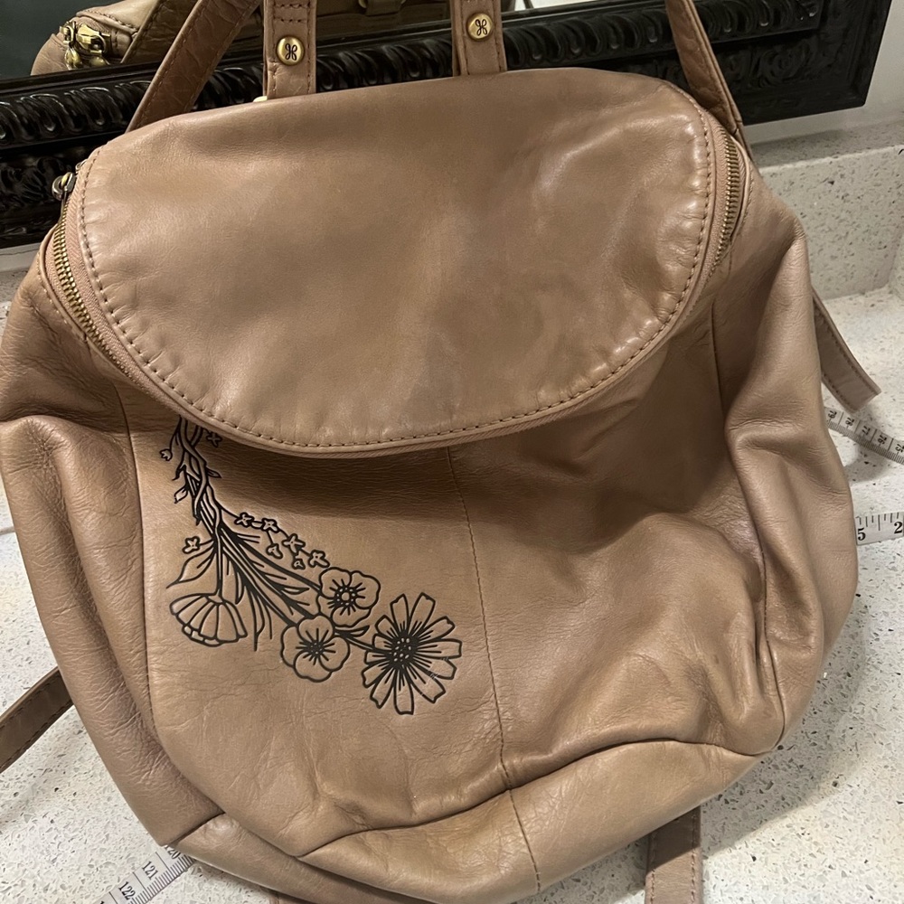 HOBO BRAND RIVER EMBOSSED FLOWER DESIGN IN BLACK ON TAUPE LEATHER EUC